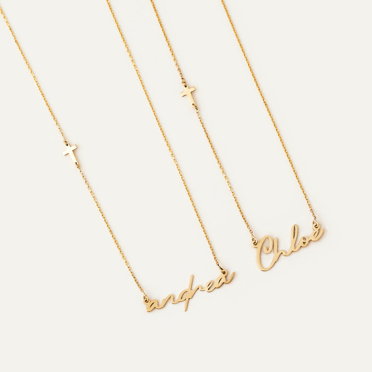 Individual name necklace with side cross in 585 gold