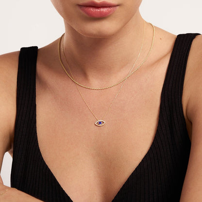 Collier pendentif ouvert mauvais œil diamant et saphir en or 18 carats