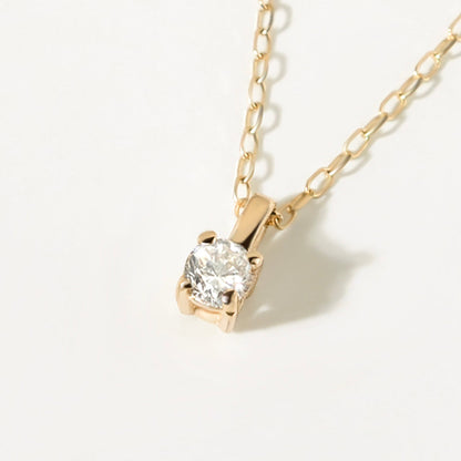 Round 4-stone diamond pendant in 585 white gold with solitaire