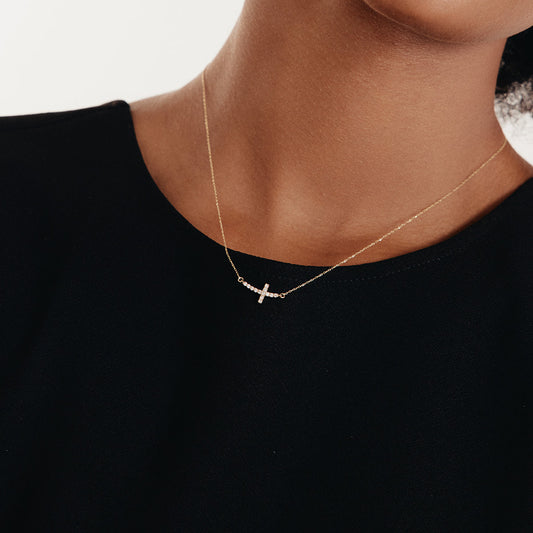 Curved diamond cross necklace made of 585 gold