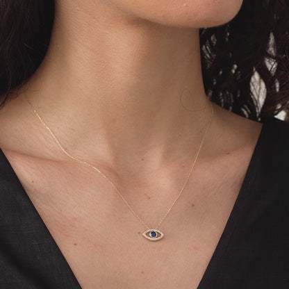 Collier pendentif ouvert mauvais œil diamant et saphir en or 18 carats